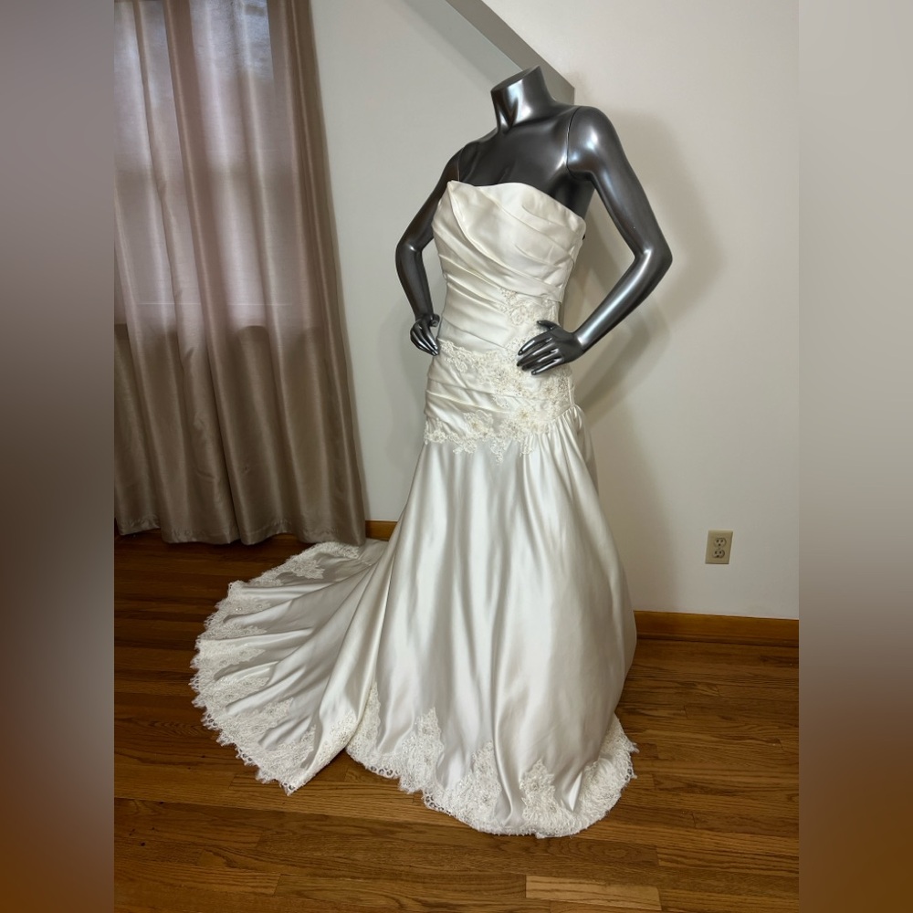 Elegant Strapless ivory Eden  Bridals RN 75428 wedding gown.